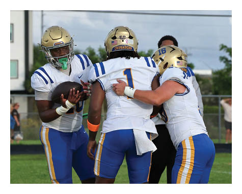 Two football players celebrating a touchdown with one player jumping in the air. AI generated content