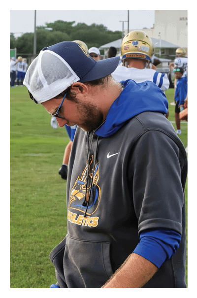 A young man wearing a football jersey with the name Vista on the back. AI generated content
