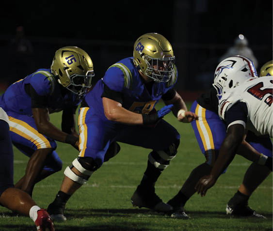 A group of football players celebrating a victory. AI generated content
