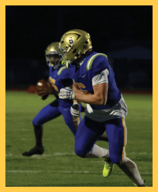 A football player in a white uniform is running with a football in his hand. AI generated content