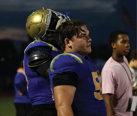 A group of football players celebrating a victory. AI generated content