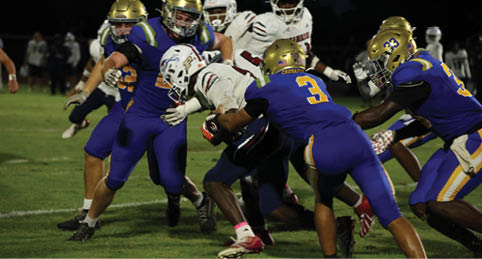 Two men wearing football uniforms are hugging each other on a field. AI generated content