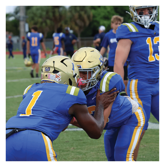 Two football players wearing Vista jerseys and holding hands. AI generated content