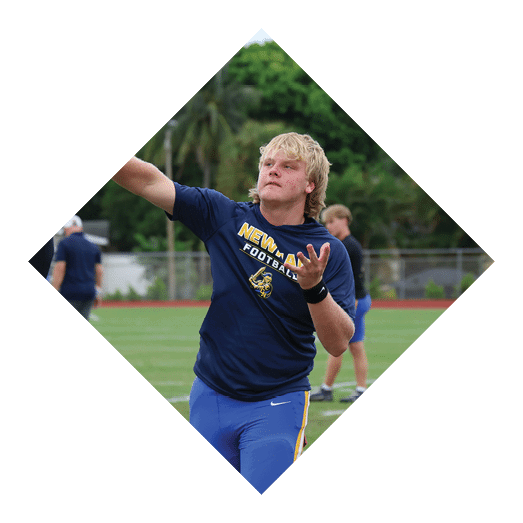 A female football player is kicking a football on a field. AI generated content