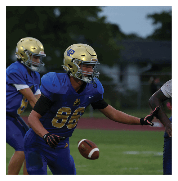 Two football players wearing Vista jerseys and holding hands. AI generated content