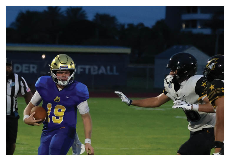 A group of football players on a field, one of them is running with a football. AI generated content