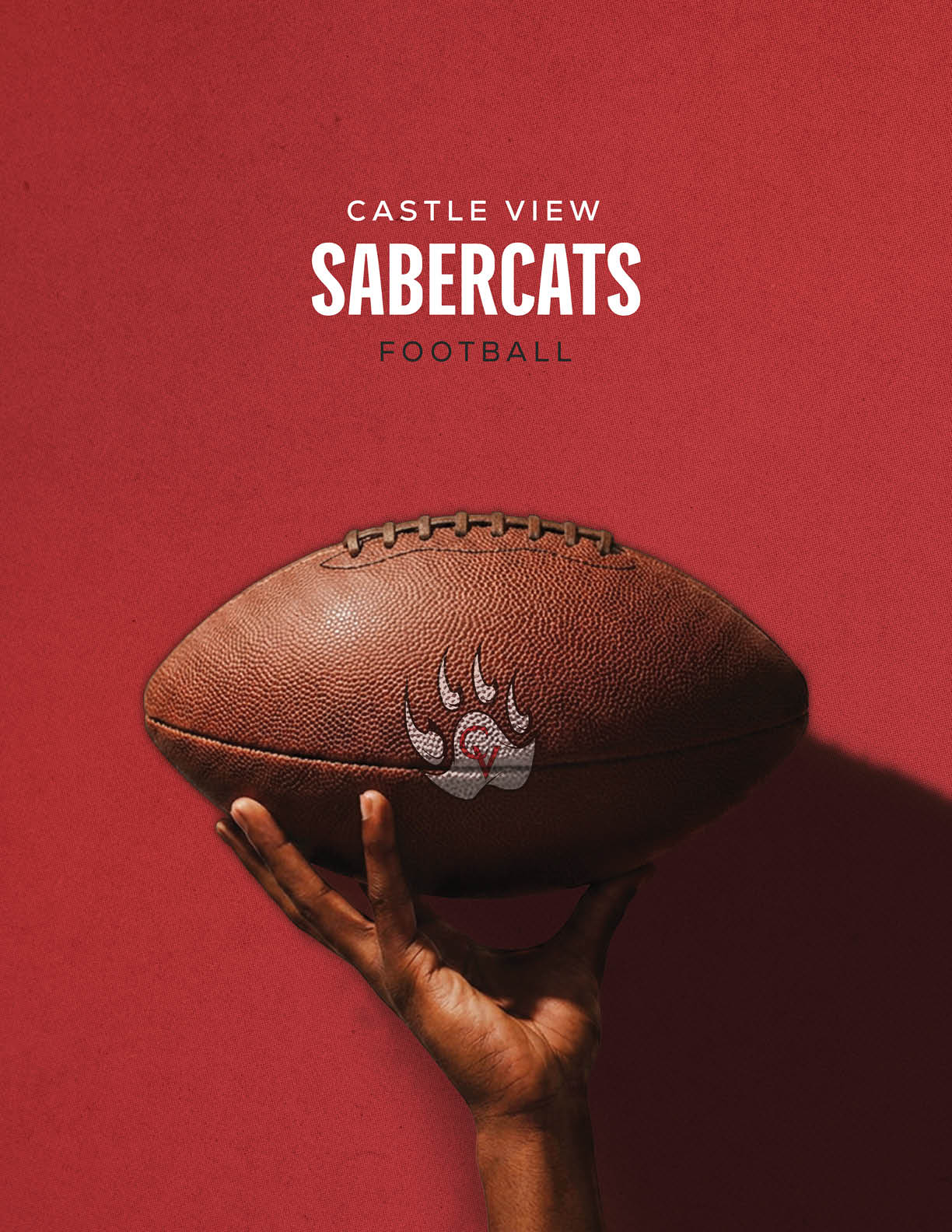 A hand is holding a football against a red background with the text Castle View Sabercats Football above it. Description generated by AI