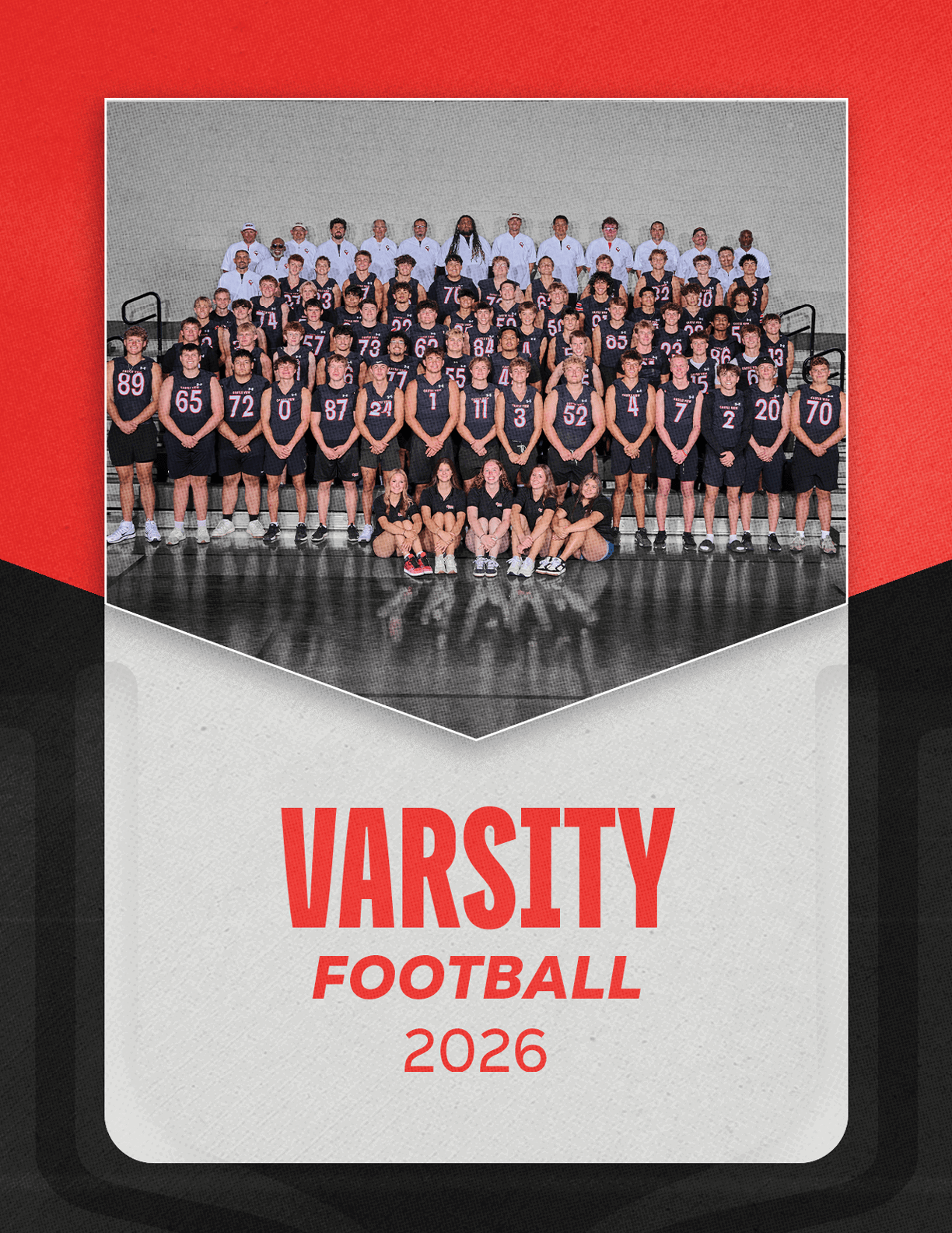 A group of football players sitting on a bench. Description generated by AI