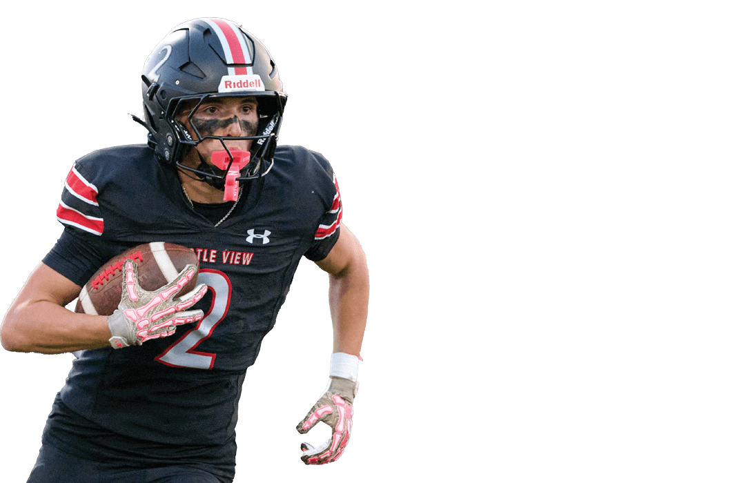 Person wearing a black football uniform with red and white stripes is running while holding a football. Description generated by AI