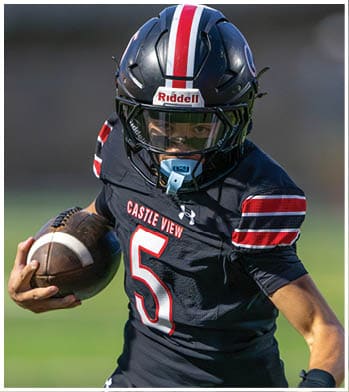A person wearing a black football uniform with “Castle View" and the number 5 on it is holding a football and wearing a black helmet with a red and white stripe. Description generated by AI