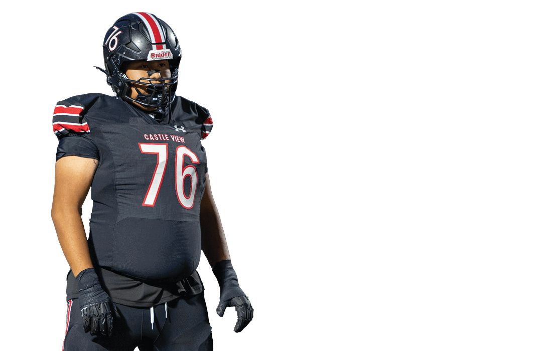 A person wearing a black football uniform with the number 76 and the words Castle View on the jersey stands in a ready position. Description generated by AI