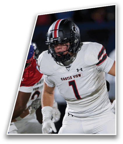 Two football players in helmets and uniforms are engaged in a play on the field during a game. Description generated by AI