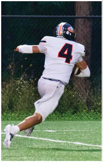 A group of football players celebrating a touchdown. Description generated by AI