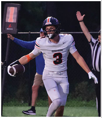 A group of football players celebrating a touchdown. Description generated by AI