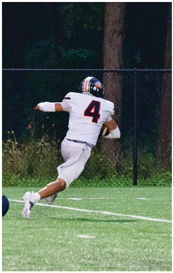 A group of football players celebrating a touchdown. Description generated by AI