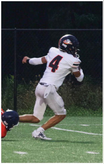 A group of football players celebrating a touchdown. Description generated by AI