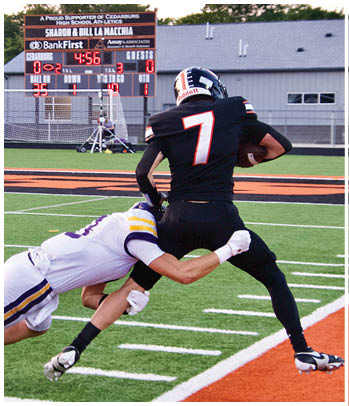 A group of football players celebrating a touchdown. Description generated by AI