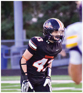 A group of football players celebrating a touchdown. Description generated by AI