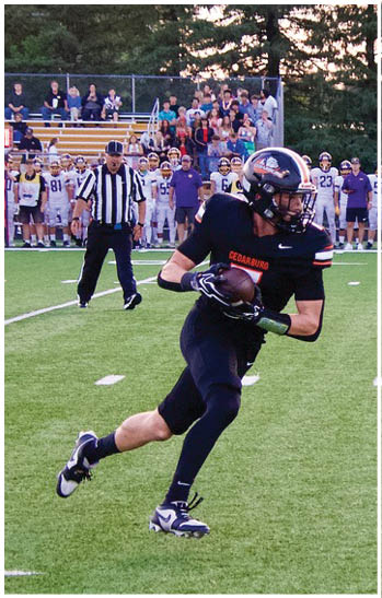 A group of football players celebrating a touchdown. Description generated by AI