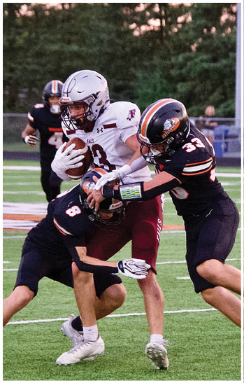 A group of football players celebrating a touchdown. Description generated by AI