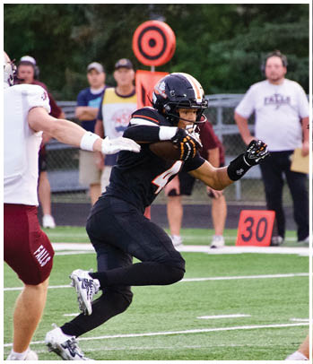 A group of football players celebrating a touchdown. Description generated by AI