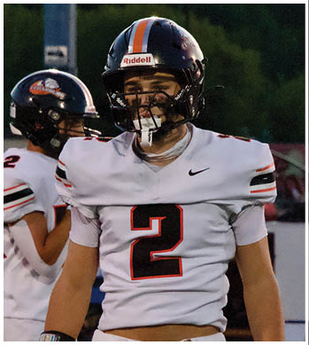 A group of football players celebrating a touchdown. Description generated by AI