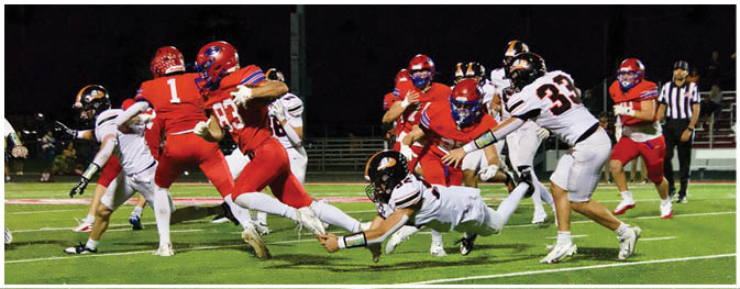 A group of football players on a field. Description generated by AI