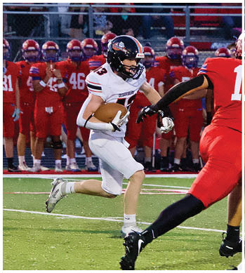 A group of football players celebrating a touchdown. Description generated by AI