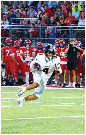 A group of football players celebrating a touchdown. Description generated by AI