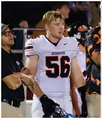 A group of football players celebrating a touchdown. Description generated by AI