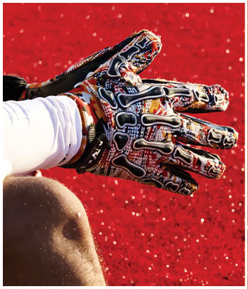 A group of football players celebrating a touchdown. Description generated by AI