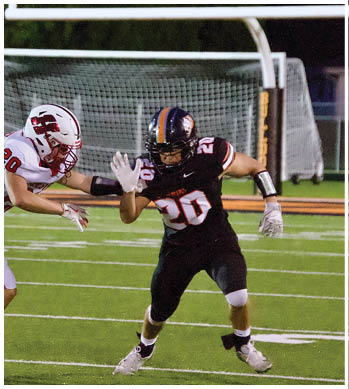 A group of football players celebrating a touchdown. Description generated by AI