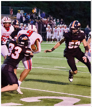 A group of football players celebrating a touchdown. Description generated by AI