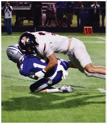 A group of football players celebrating a touchdown. Description generated by AI