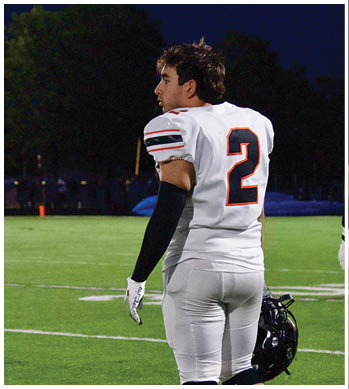 A group of football players celebrating a touchdown. Description generated by AI