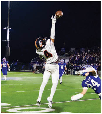 A group of football players celebrating a touchdown. Description generated by AI