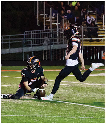A group of football players celebrating a touchdown. Description generated by AI
