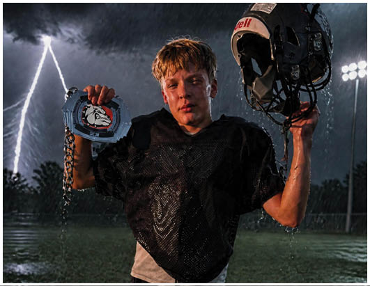 A group of football players on a field. Description generated by AI