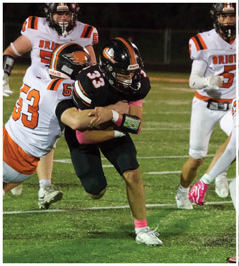 A group of football players celebrating a touchdown. Description generated by AI