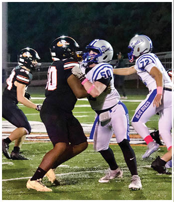A group of football players celebrating a touchdown. Description generated by AI