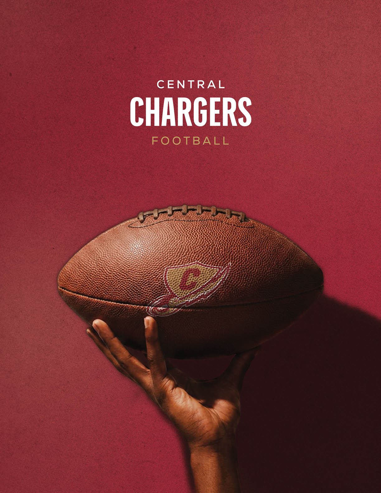 A hand is holding a football with a Central Chargers logo against a solid maroon background with the text Central Chargers Football above. Description generated by AI
