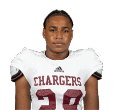 A person with braided hair wearing a white football jersey with shoulder pads and the word Chargers and the number 28 on the front. Description generated by AI