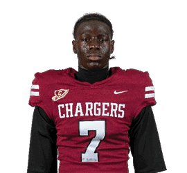 A person wearing a maroon football jersey with the word Chargers and the number 7 on the front. Description generated by AI