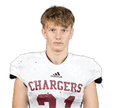 Person with short tousled hair wearing a white football jersey with the word Chargers and the number 21 on it. Description generated by AI