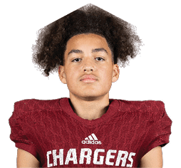 A person with curly hair wearing a maroon football jersey with the word Chargers and the number 17 on it is looking straight ahead against a white background. Description generated by AI