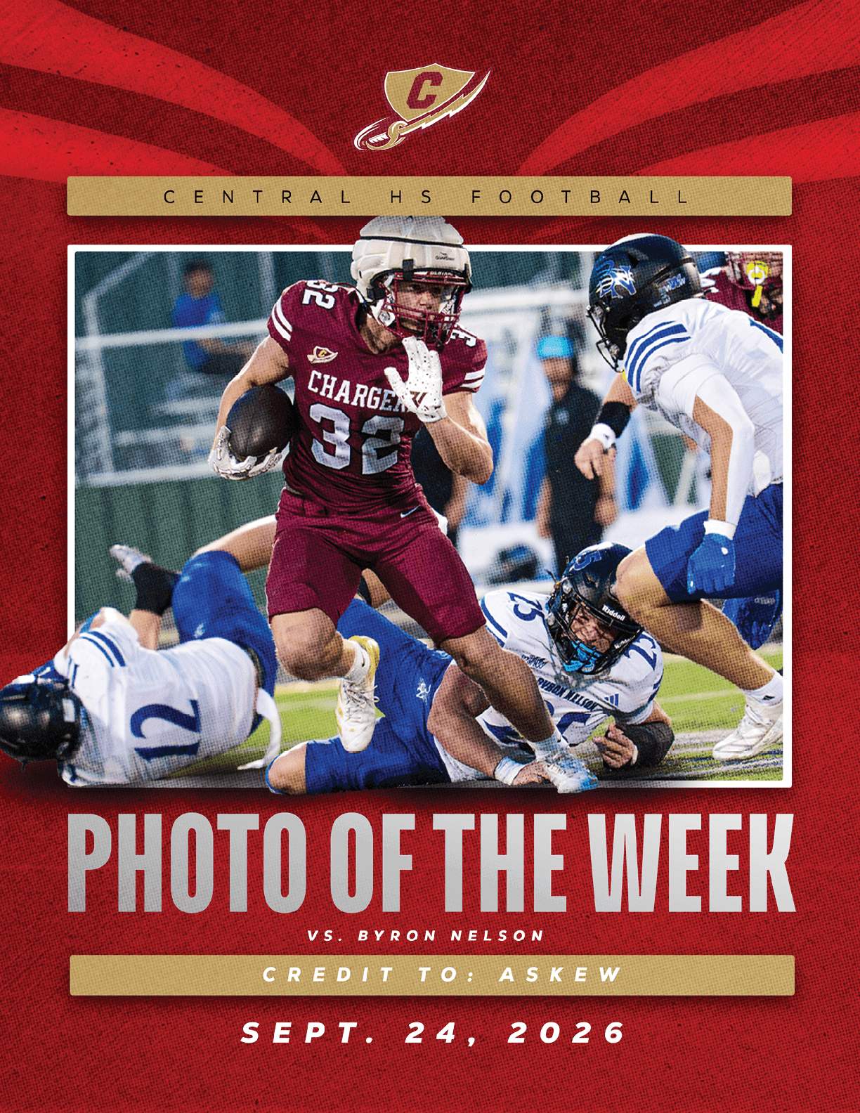 A person in a red football uniform running with the ball while another person in a white football uniform attempts to tackle them on a football field during a game. Description generated by AI
