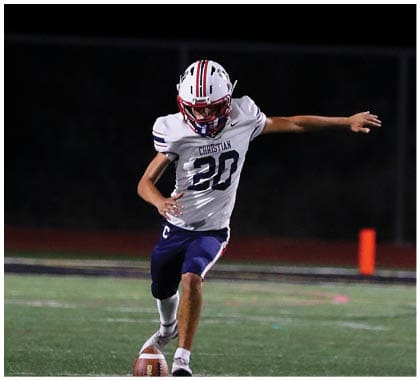 A football player running on the field. Description generated by AI
