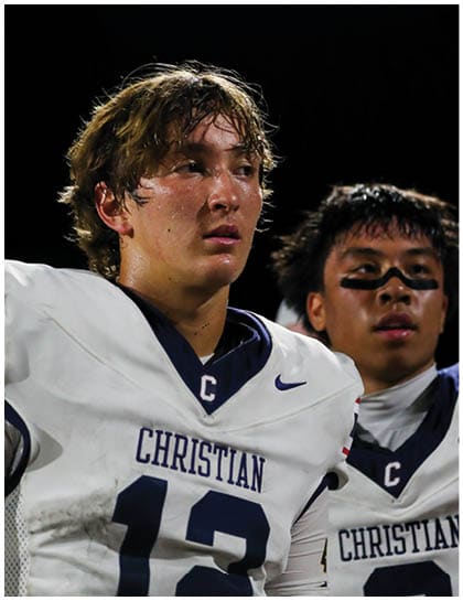 A football player wearing a blue jersey with the number 58 on it. Description generated by AI