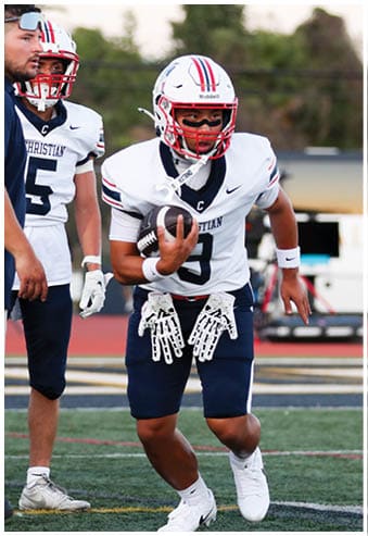 A football player running on the field. Description generated by AI