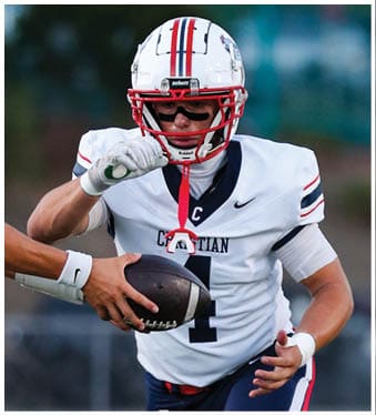 A football player running on the field. Description generated by AI